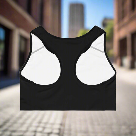 Black sports bra with white mesh panels on a white background
